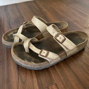 Pearl white Birkenstock Mayari sandals.